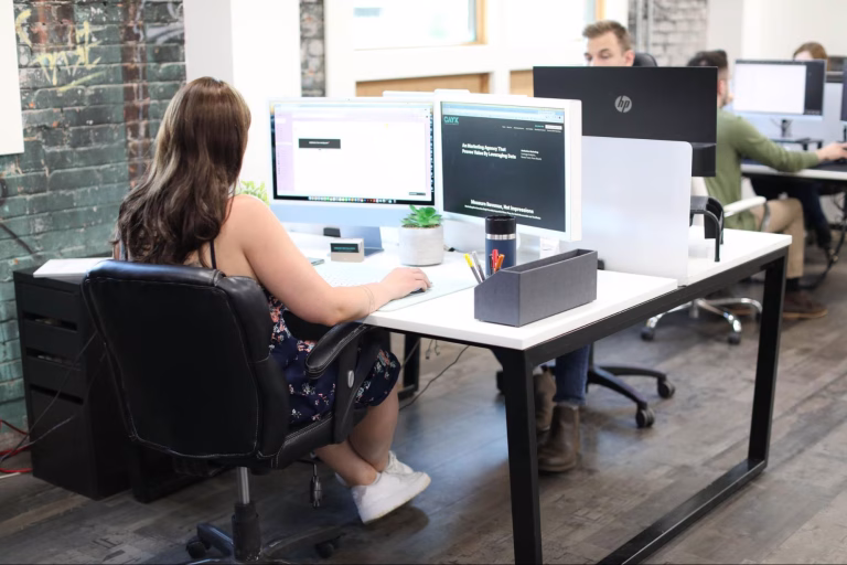 A web developer creating a website design that meets the essential standards for 2025.