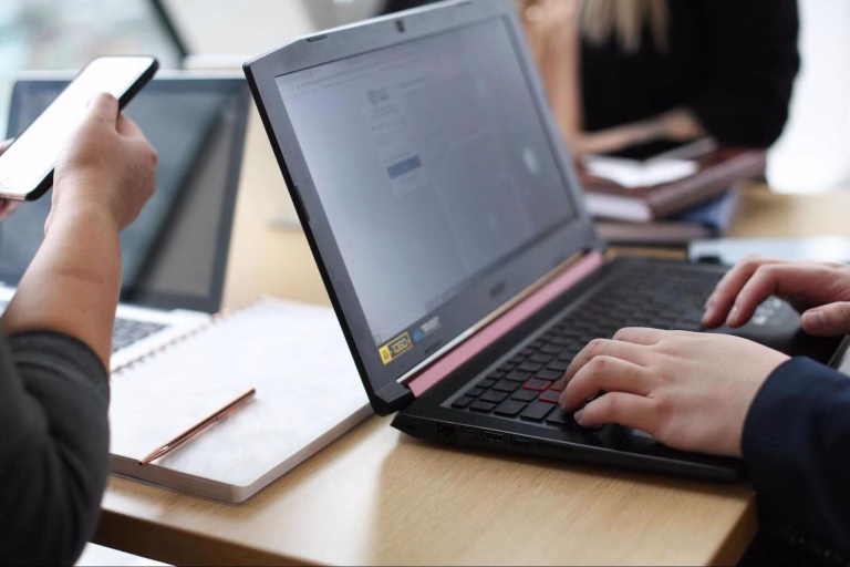 A professional marketer thoughtfully analyzing search engine data on a laptop, proving that is SEO still relevant for connecting businesses with their target audience.