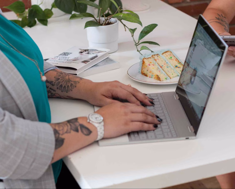 Professional working on a laptop at a desk, representing website design for growing businesses with a focus on productivity and digital strategy.
