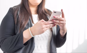 Handheld smartphone usage showing importance of designing your website for user experience and usability.