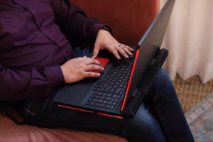 Person working on laptop for website design and development, building and optimizing a responsive website.