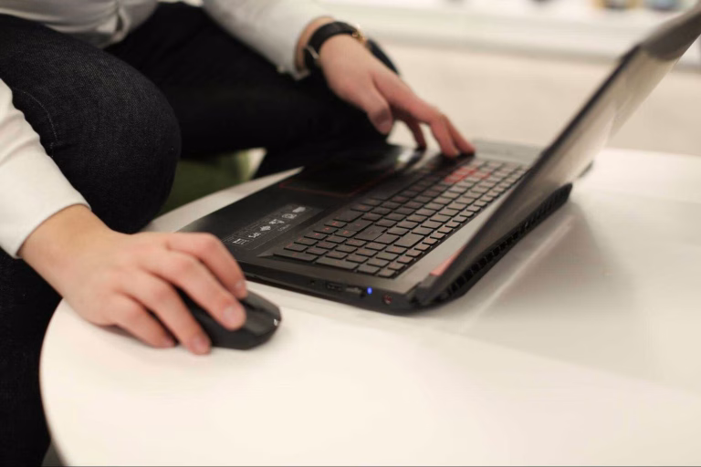 Professional researching online information during the B2B buyer journey.